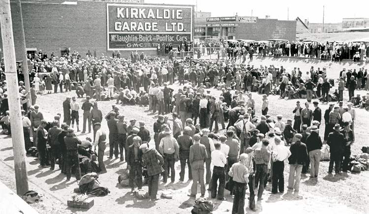 On-to-Ottawa trekkers on a rest break in Swift Current. It was here that Winnipeg Tribune reporter Charles Woodsworth, dressed as a hobo, joined the strikers.