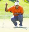 Chris Russell / Columbus Dispatch / MCT
Tiger Woods lines up a putt during the first round of the Memorial Tournament at Muirfield Village. He shot 71.
