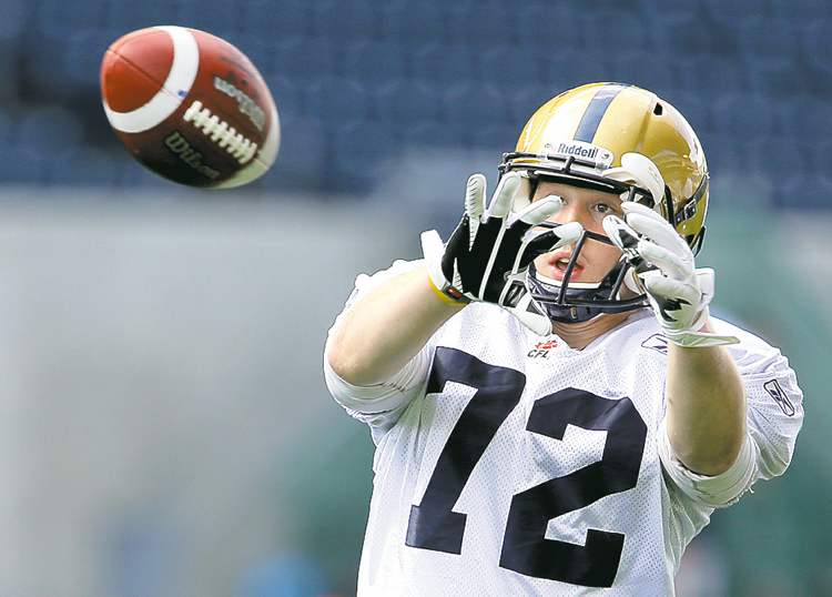 Winnipeg Blue Bombers' Brett Carter (72) catches a pass during a drill at practice at Investors Group Field, Saturday, June 8, 2013. (TREVOR HAGAN/WINNIPEG FREE PRESS)