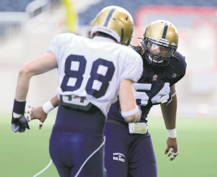 photos by trevor hagan / winnipeg free press
Blue Bomber defensive lineman Kenny Mainor blocks receiver Jade Etienne (88) during practice at Investors Group Field on Saturday. Mainor had seven sacks last season.