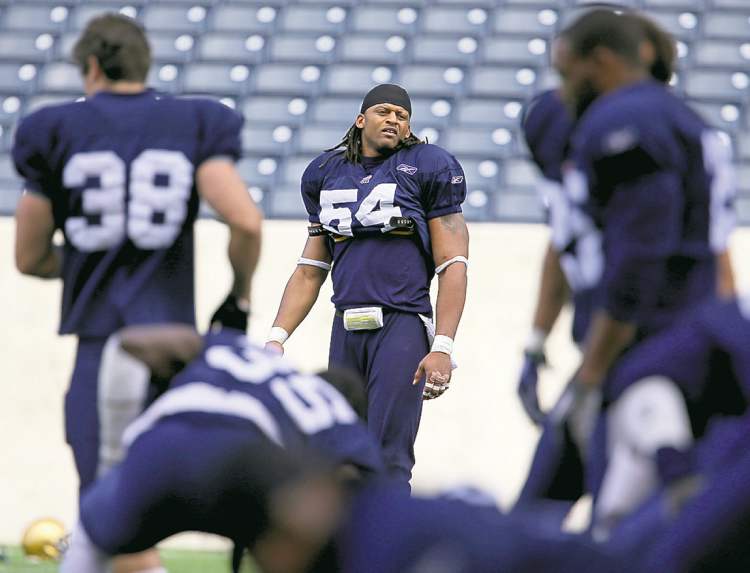 Defensive end Kenny Mainor (54) is making his presence felt in camp.
