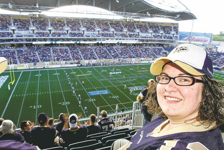 JESSICA BURTNICK / WINNIPEG FREE PRESS
Bomber fan Felise Coutu has warm feelings for the old stadium -- she took her engagement photos there -- but says the comforts of Investors Group Field have won her over.