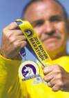 John Woods / Winnipeg Free Press  
Bob Conarroe with his 2013 Boston Marathon medal.