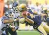 JOE BRYKSA / WINNIPEG FREE PRESS 
Winnipeg quarterback Buck Pierce is sacked by Toronto linebacker Bryan Payton during first-quarter action at Investors Group Field Wednesday night.