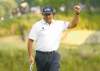 REUTERS
Adam Hunger / REUTERSPhil Mickelson is pumped after draining a birdie putt on 17 Saturday, en route to an even-par 70 at Merion.