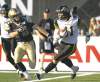 The Canadian Press
Aaron Lynett / the canadian press archives
Bombers� Brett Carter (left) tracks down Ticats� Erik Harris on an interception return in their pre-season game Thursday.