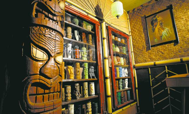 WAYNE GLOWACKI/WINNIPEG FREE PRESS
Mugs, masks and Moai statuettes provide the South Pacific cred
