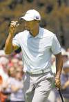 CP
Mark Duncan / the associated pressTiger Woods acknowledges applause from the gallery after a birdie on the first hole in the third round of the Bridgestone Invitational golf tournament Saturday.