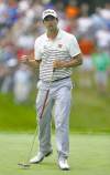 Charlie Neibergall / the associated press
Adam Scott, he of the belly putter, drains a birdie putt.