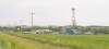 BARTLEY KIVES / WINNIPEG FREE PRESS
The presence of a drill, tanks and trailers can indicate a frack is underway in the oilfield south of Cromer. Meanwhile, the area’s roads draw bitter complaints.