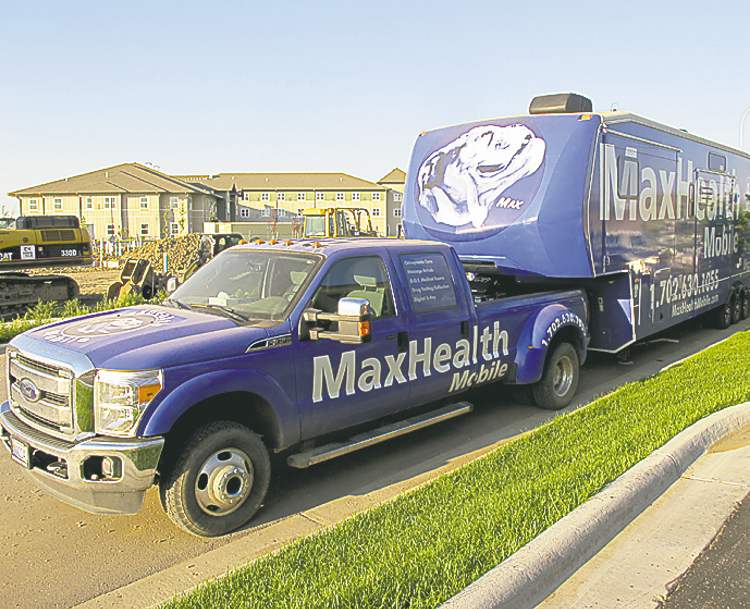 BARTLEY KIVES / WINNIPEG FREE PRESS
A medical services truck parked at a Williston hotel. The booming North Dakota city is considering a crackdown on mobile businesses that cater to the transient-worker population.