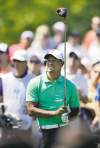 CP
Mel Evans / the associated pressTiger Woods watches his shot on the sixth hole during the third round of The Barclays.
