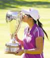 Jason Franson / The Canadian Press
Lydia Ko kisses the trophy after winning the LPGA Canadian Women;s Open in Edmonton on Sunday.
