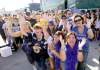 Ruth Bonneville / Winnipeg Free Press
Faithful Winnipeg Blue Bombers fans beseech higher powers for a win in the Labour Day Classic game before they board a bus for Regina on Saturday.