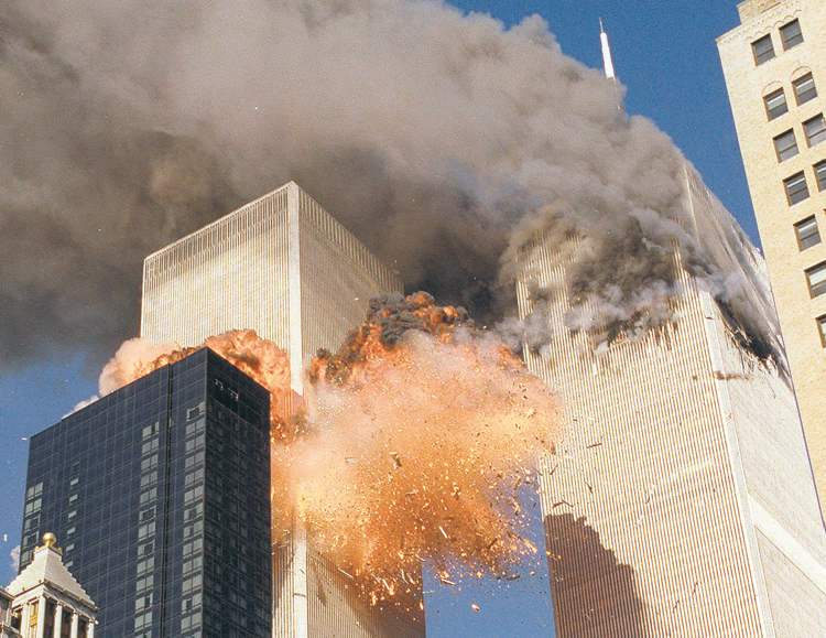 Chao Soi Cheong / The Assoicated Press archives
In this September 11, 2001 file photo, smoke billows from World Trade Center Tower 1 and flames explode from Tower 2 as it is struck by American Airlines Flight 175, when terrorists crashed hijacked airliners into the buildings.