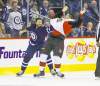 trevor hagan / winnipeg free press
Jet's Anthony Peluso tangles with Sens' Michael Sdao.