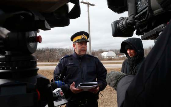 WAYNE GLOWACKI / WINNIPEG FREE PRESSManitoba RCMP spokesman Sgt. Bert Paquet speaks to reporters Thursday morning near Dakota Tipi First Nation, where police are still searching for a suspect involved in shootings that injured two people.