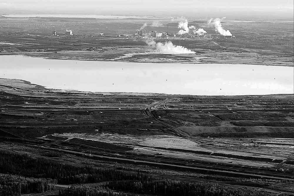 CP
This 2011 aerial photo shows an oilsands tailings pond at a mine near Fort McMurray, Alta.