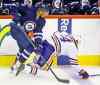 Trevor Hagan / the canadian press
The Jets' Evander Kane (9) takes down the Oilers' Nail Yakupov (64) during their pre-season game at the MTS Centre Winnipeg Tuesday.