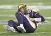 JOE BRYKSA / WINNIPEG FREE PRESS
Blue Bombers starting QB Max Hall goes down in pain after absorbing a huge hit in the fourth quarter on Friday night. He left the game and did not return.