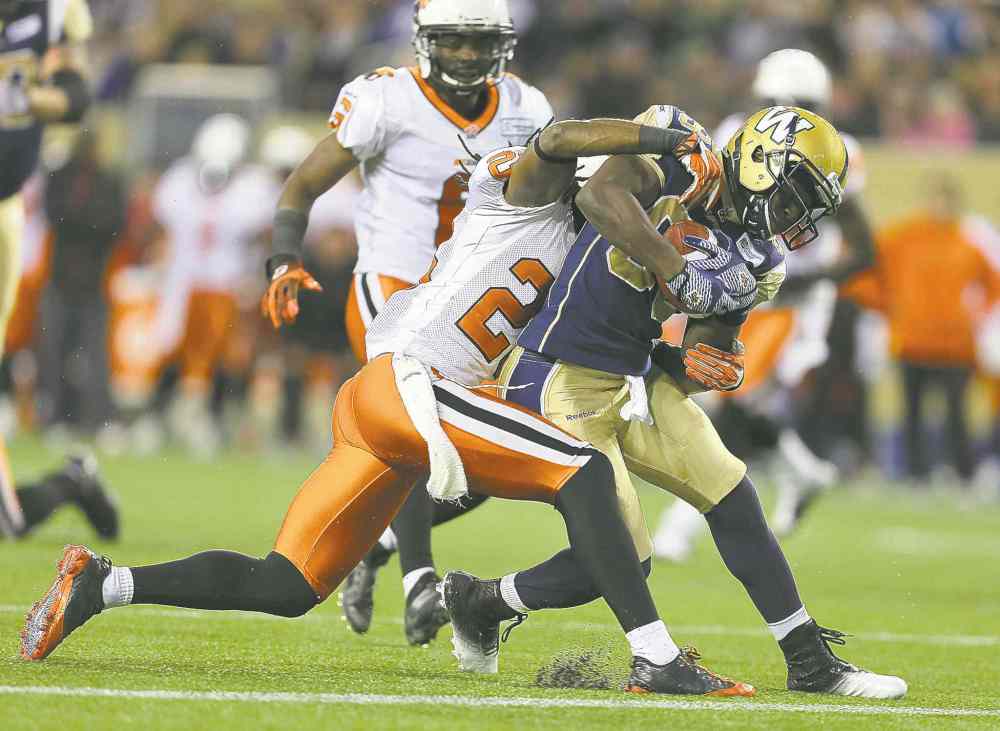 Jason Halstead / Winnipeg Free Press
B.C. Lions linebacker Korey Jones wraps up Winnipeg Blue Bombers receiver Clarence Denmark at Investors Group Field on Friday night.