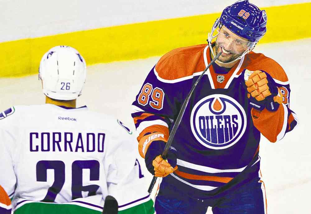 Jason Franson / the canadian press archives
Edmonton's Sam Gagner celebrates a goal during pre-season action on Sept. 21. Gagner was injured later in the game.