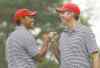 CP
Darron Cummings / the associated pressTiger Woods (left) and Matt Kuchar fist bump after Kuchar made a birdie on the fourth hole Saturday.