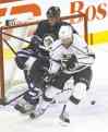 JOE BRYKSA / WINNIPEG FREE PRESS
The rejuvenated Jeff Carter battles with Jets defender Zach Bogosian Friday night at the MTS Centre.