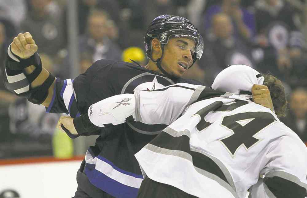 JOE BRYKSA / WINNIPEG FREE PRESS
Winnipeg's Evander Kane hammers on L.A's Colin Fraser during second-period fisticuffs.