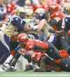 CP
Jeff McIntosh / the canadian press
Winnipeg�s Bryant Turner Jr. (left) and Alex Hall (right) look on as Calgary running back Jon Cornish (centre) dives for extra yardage.