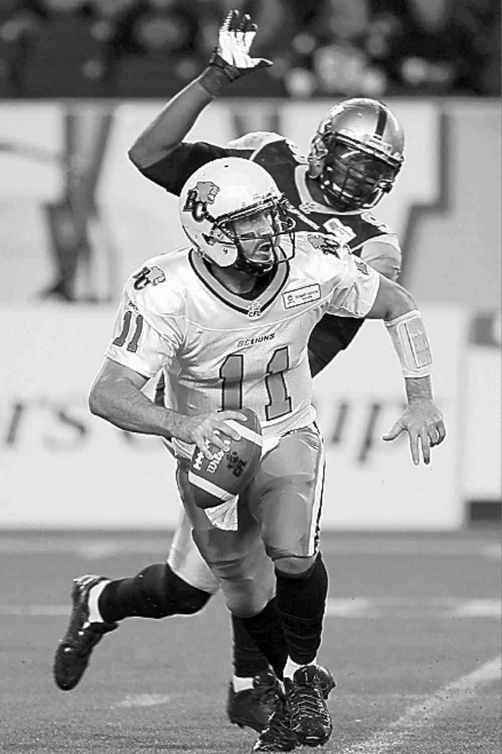 CP
john woods / the canadian press archives
Former Bomber DE Alex Hall chases down former Bomber QB Buck Pierce.
