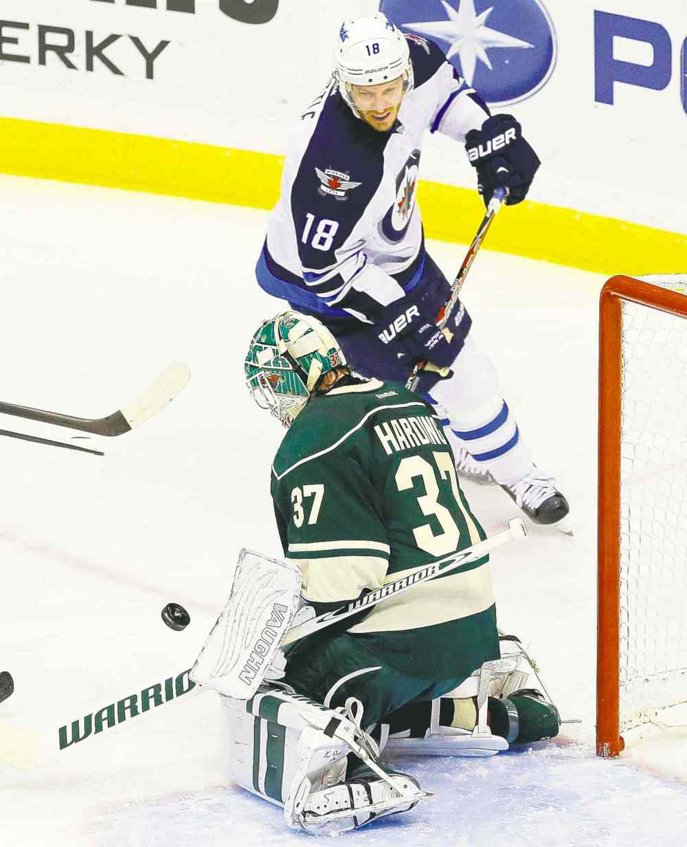 CP
Jim Mone / the associated press
Winnipeg�s Bryan Little swoops in for the rebound as Wild goalie Josh Harding stops a shot in the first period Thursday evening.