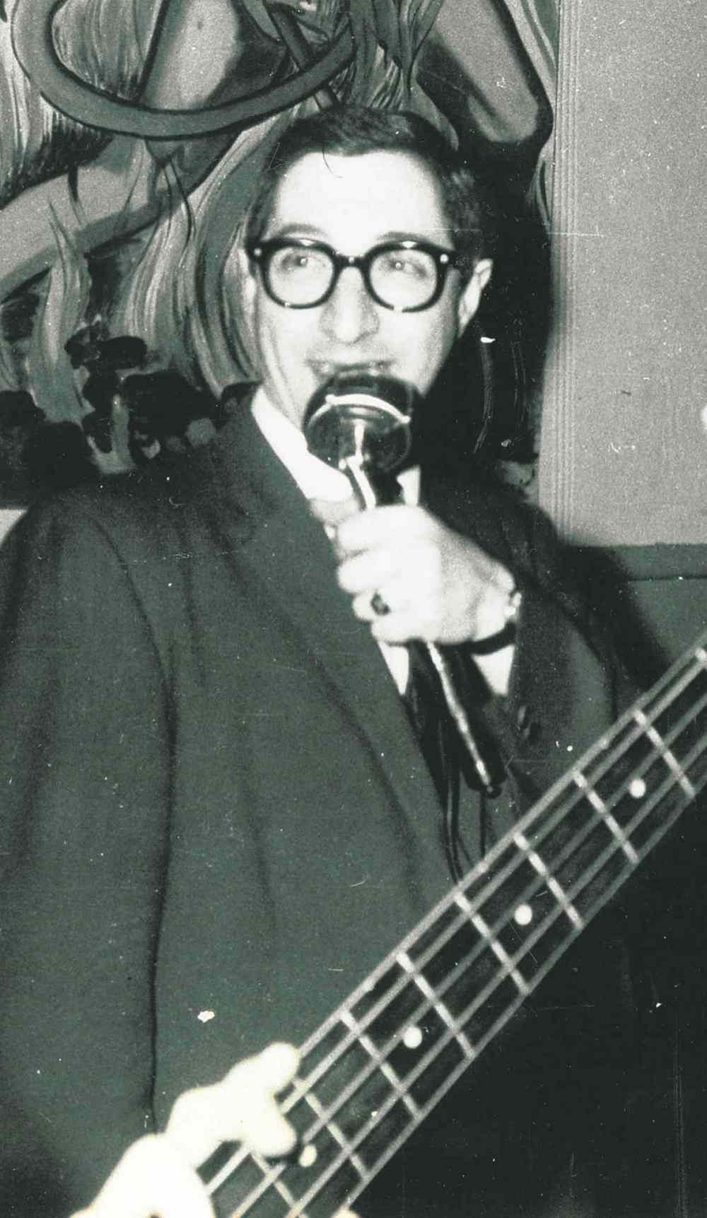 Doc Steen handles emceeing duties at a dance featuring the Crescendos circa 1965.