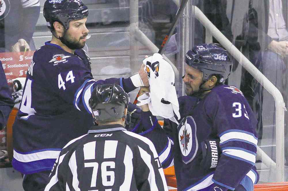 CP
John Woods / The Canadian Press
Big Buff takes a towel from Zach Bogosian after being clipped by a wayward stick in Friday�s first period.