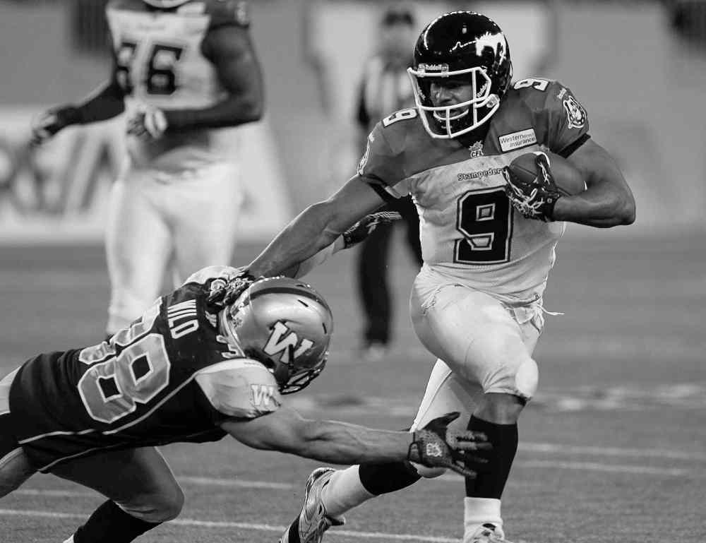 John Woods / THE CANADIAN PRESS ARCHIVES
Stampeders running back Jon Cornish is just 455 yards away from the hallowed ground of a 2,000-yard season. Only one other has surpassed that mark: Mike Pringle.