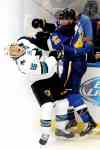 CP
St. Louis Blues� David Backes (42) checks San Jose Sharks� James Sheppard (15) during the second period of an NHL hockey game Tuesday, Oct. 15, 2013, in St. Louis. (AP Photo/Bill Boyce)