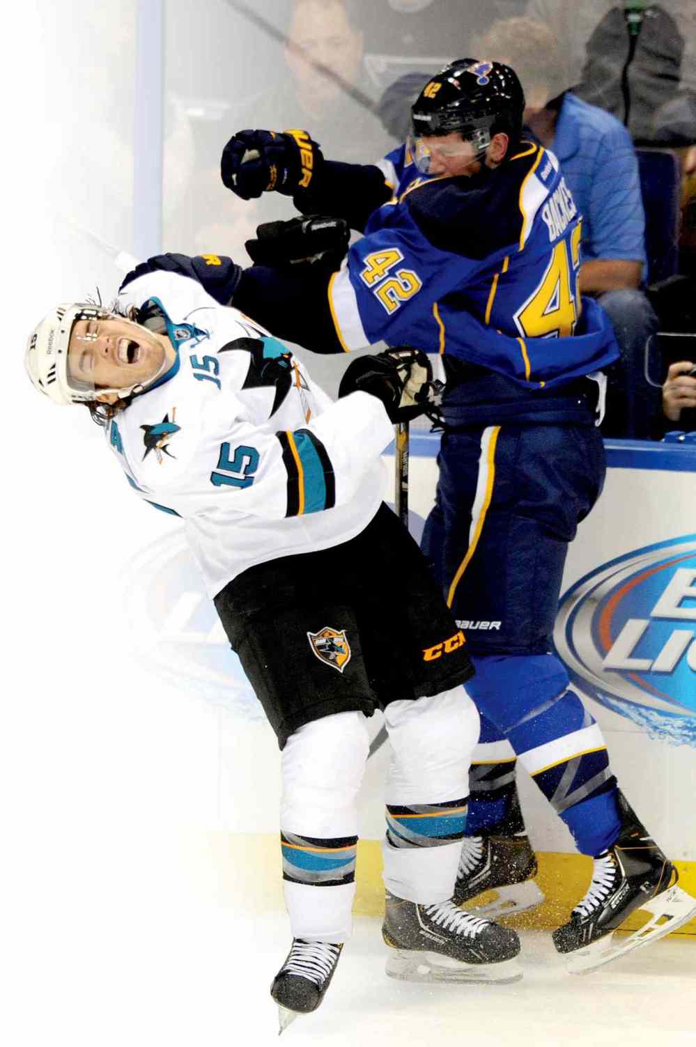 CP
St. Louis Blues� David Backes (42) checks San Jose Sharks� James Sheppard (15) during the second period of an NHL hockey game Tuesday, Oct. 15, 2013, in St. Louis. (AP Photo/Bill Boyce)