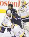 John Woods / WINNIPEG FREE PRESS
Dustin Byfuglien mixes it up with Nashvillels Kevin Klein in front of Preds goaltender Carter Hutton on Sunday night.
