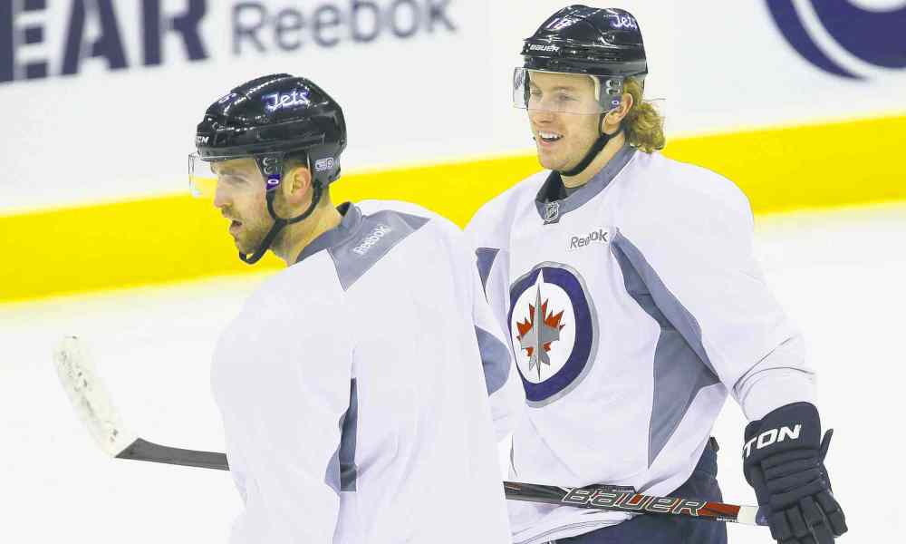 TREVOR HAGAN / WINNIPEG FREE PRESS
Jets captain Andrew Ladd (left) and Bryan Little know the players have to improve as individuals and a team before they can call each other to account for poor play.