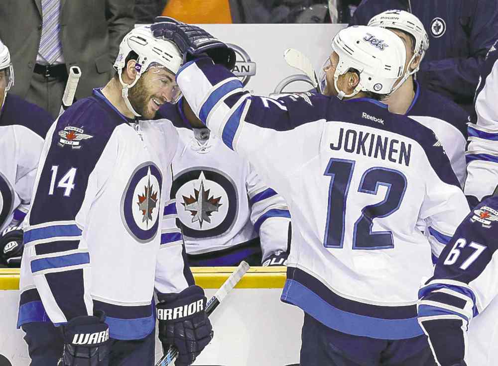 CP
Mark Humphrey / the associated press
Anthony Peluso celebrates with Olli Jokinen after scoring his first NHL goal.