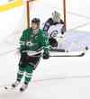 Tony Gutierrez / The Associated Press
Ondrej Pavelec stones Stars captain Jamie Benn in the shootout.