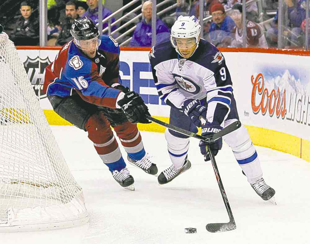 David Zalubowski / The Associated Press
Evander Kane tries the wraparound.
