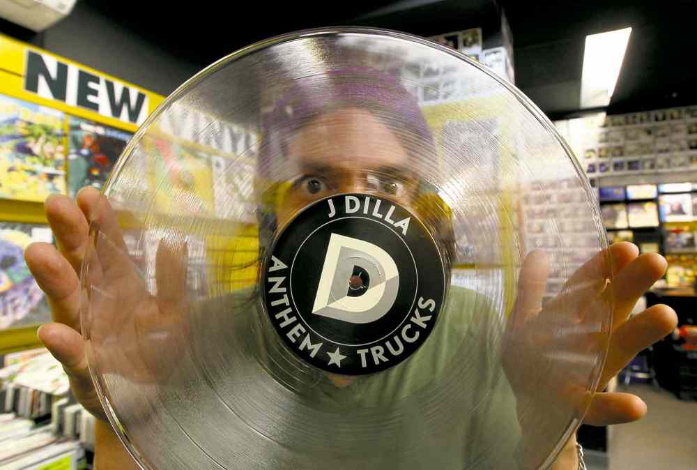 JOE BRYKSA / WINNIPEG FREE PRESS
Music Trader�s Jason Churko shows off some vinyl.