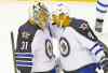 CP
Paul Sancya / the associated press
Jets goalie Ondrej Pavelec celebrates Tuesday's win with Evander Kane.