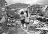 CP
Survivors of typhoon Haiyan walk amid ruins in Maraboth, Philippines.