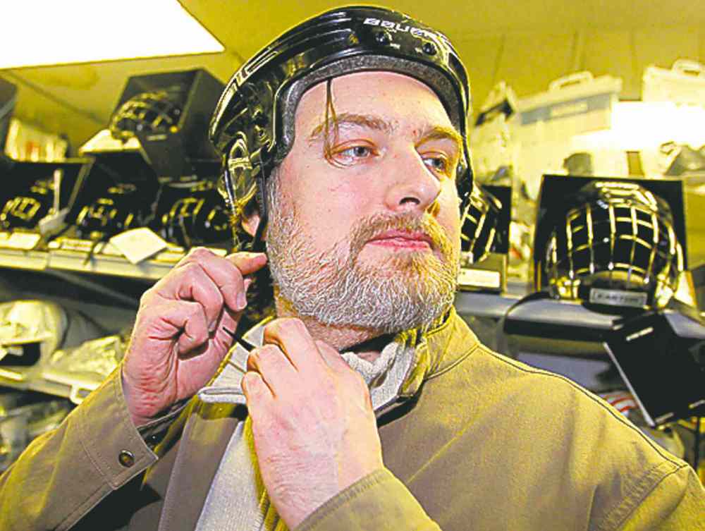 BORIS MINKEVICH / WINNIPEG FREE PRESS
Marcus Malbasa tries on a helmet Wednesday.