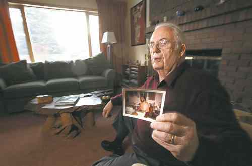 Phil Hossack / Winnipeg Free Press 
John Millar with a photo of himself near the time Kennedy was killed. Millar worked on JFK's campaign and later with Robert Kennedy and Rev. Martin Luther King.