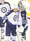bill kostroun / the associated press
Jets' Ondrej Pavelec (31) and Evander Kane celebrate after beating the Devils in Newark, N.J., Monday.