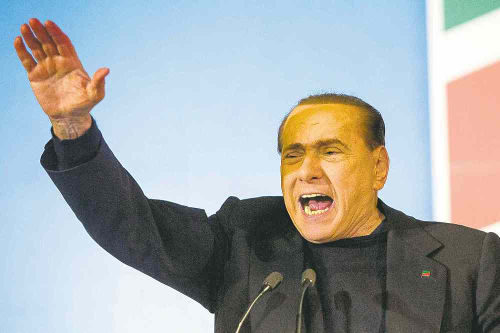CP
Roberto Monaldo / The Associated Press
Silvio Berlusconi addresses a rally in Rome. The Italian Senate turfed the three-time ex-premier from Parliament over his tax fraud conviction.