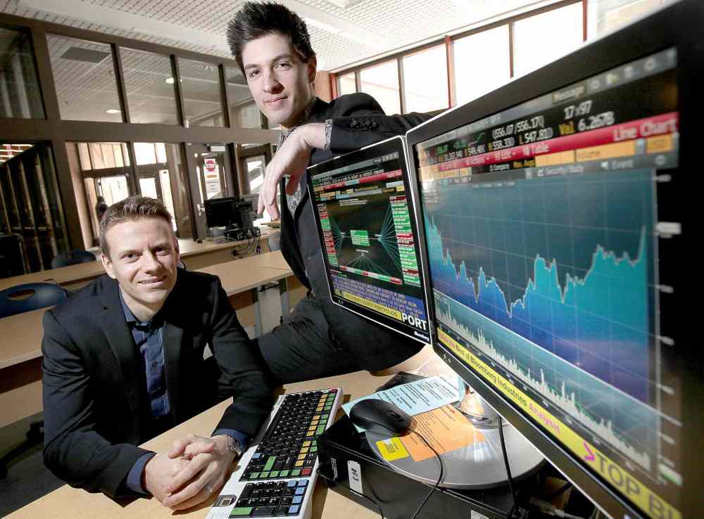 Phil Hossack / Winnipeg Free Press
Nathan Moncrief (left) and Josh Olfert at the University of Manitoba's Asper School of Business. They've become successful investors at a young age.